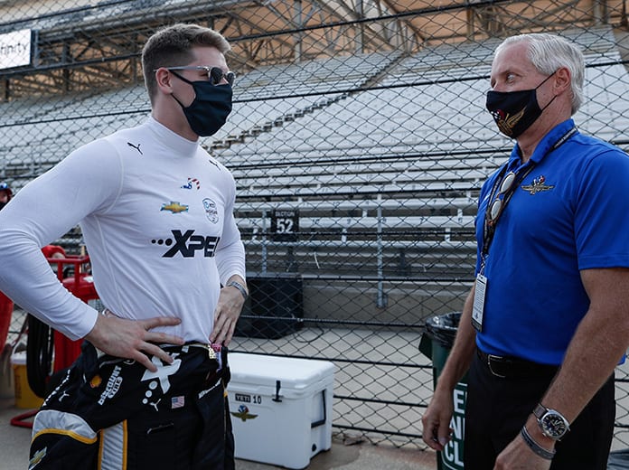 Penske Corp. President Bud Denker, shown here speaking with Josef Newgarden, is optimistic fans will be allowed for the 2021 Indianapolis 500. (IndyCar Photo)