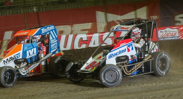 Christopher Bell (84) battles Kyle Larson for the race lead during Saturday's Lucas Oil Chili Bowl Nationals finale. (Brendon Bauman Photo)