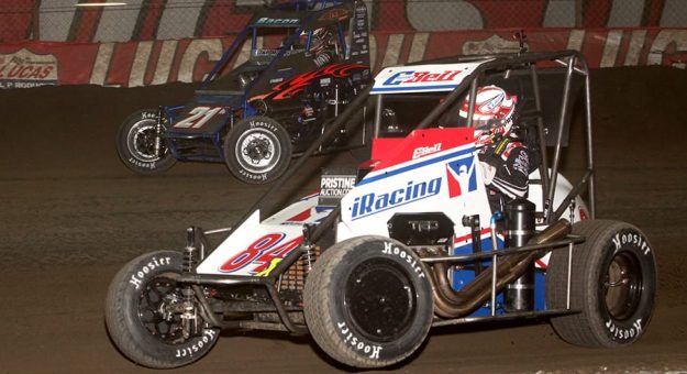 Christopher Bell (84X) battles Brady Bacon during Thursday's Chili Bowl qualifying night feature at Tulsa Expo Raceway. (Richard Bales Photo)