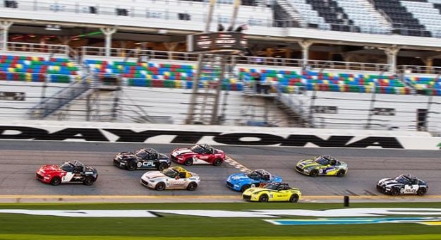 Gresham Wagner takes the checkered flag ahead of the pack to win Thursday's Mazda MX-5 Cup opener at Daytona Int'l Speedway.