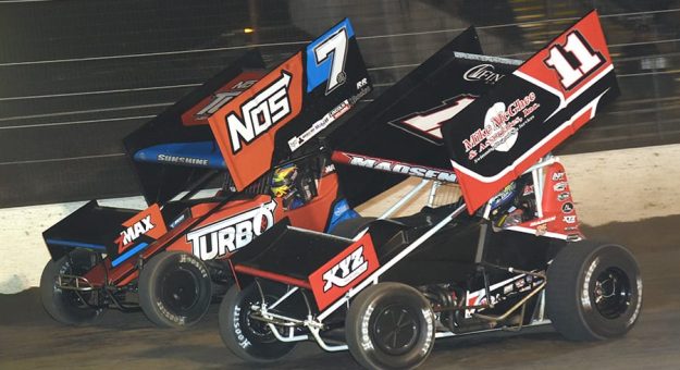 Ian Madsen (11) battles Tyler Courtney during Thursday's All Star Circuit of Champions event at Volusia Speedway Park. (Paul Arch Photo)