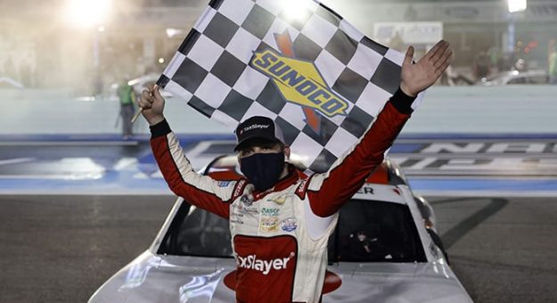 Myatt Snider poses with the checkered flag after winning his first NASCAR Xfinity Series race Saturday at Homestead-Miami Speedway. (Michael Reaves/Getty Images Photo)