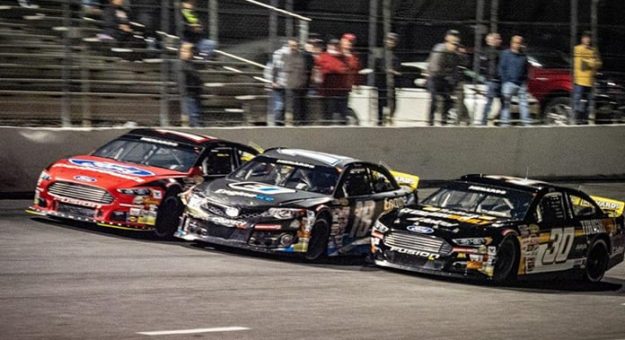 Max Gutiérrez (30) beat Sammy Smith (18) and Taylor Gray (17) to the checkered flag to win Monday's ARCA Menards Series East opener at New Smyrna Speedway. (Jason Reasin Photo)
