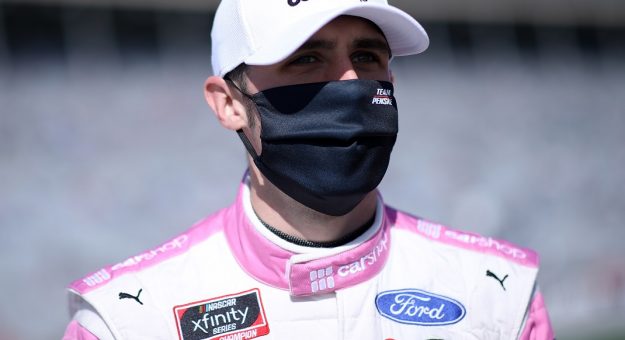 HAMPTON, GEORGIA - MARCH 20: Austin Cindric, driver of the #22 Car Shop Ford, waits on the grid prior to the NASCAR Xfinity Series EchoPark 250 at Atlanta Motor Speedway on March 20, 2021 in Hampton, Georgia. (Photo by Sean Gardner/Getty Images) | Getty Images