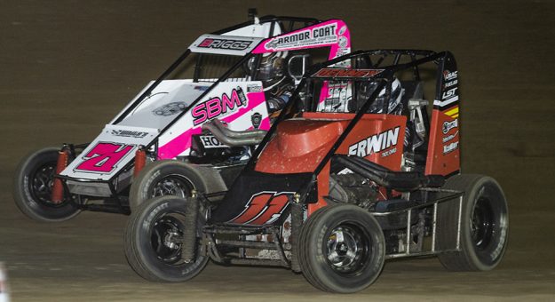 Jacob Denney (11) and Stratton Briggs battle for the lead Friday at Limaland Motorsports Park.