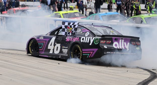 DOVER, DELAWARE - MAY 16: Alex Bowman, driver of the #48 Ally Chevrolet, does a burnout after winning the NASCAR Cup Series Drydene 400 at Dover International Speedway on May 16, 2021 in Dover, Delaware. (Photo by James Gilbert/Getty Images) | Getty Images