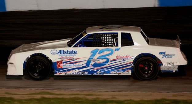 Austin Woodcox and his No. 13 on their way to victory in the 30-lap Kenny Esmont Memorial for street stocks at Indiana’s South Bend Motor Speedway Saturday night. (Stan Kalwasinski Photo)
