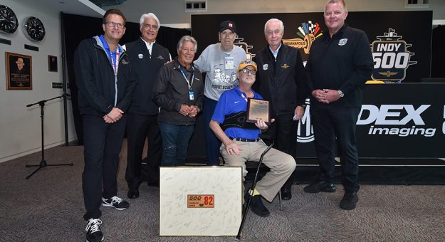Bob Jenkins (center, blue shirt) was awarded the Robin Miller Award on Friday at Indianapolis Motor Speedway. (IndyCar Photo)