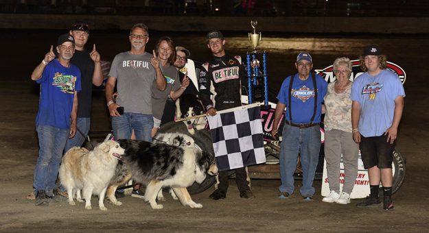 Ricky Lewis in victory lane with his family and team Saturday at Macon Speedway. (Mark Funderburk Photo)