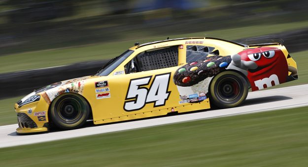 Kyle Busch on his way to victory Saturday at Road America. (HHP/Andrew Coppley Photo)