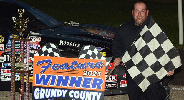 Anthony Danta poses in victory lane after winning the 50-lap Mid Season Championship race for late model stock cars at Illinois’ Grundy County Speedway Friday night. (Stan Kalwasinski Photo)