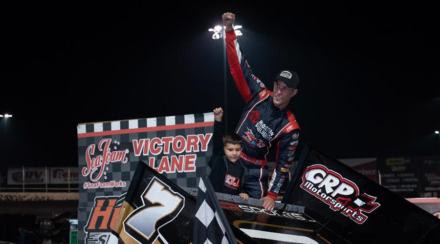 Justin Henderson celebrates after his victory Sunday at Huset's Speedway. (Tylan Porath Photo)