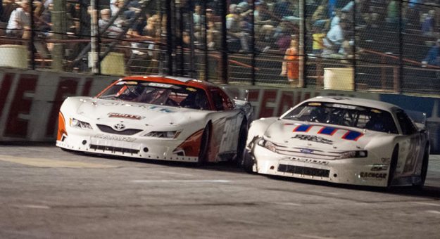 Bubba Pollard (26) battles to the inside of Chandler Smith Friday at Five Flags Speedway. (Jason Reasin Photo)