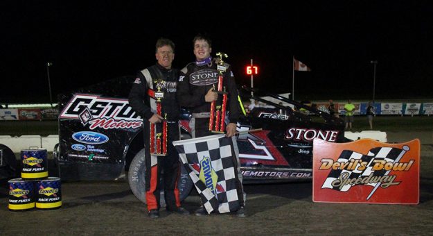 Sportsman Modified Legends Night feature winner Justin Stone (right) celebrates his $2,500 win with his father, Todd (left), who finished second in a thrilling 67-lap race at Devil's Bowl Speedway. (Barry Snelling photo)