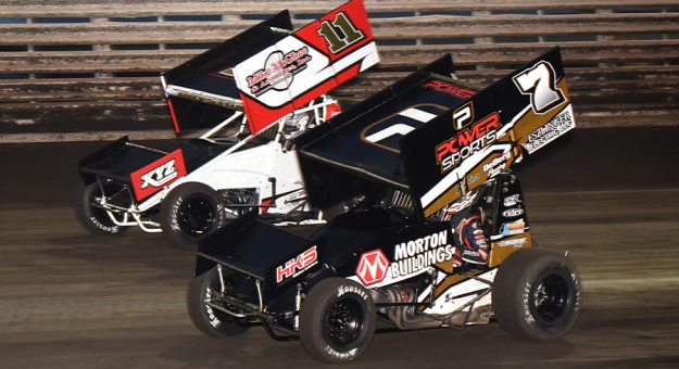 Justin Hendeson (7) battles Spencer Bayston Sunday at Knoxville Raceway. (Paul Arch Photo)