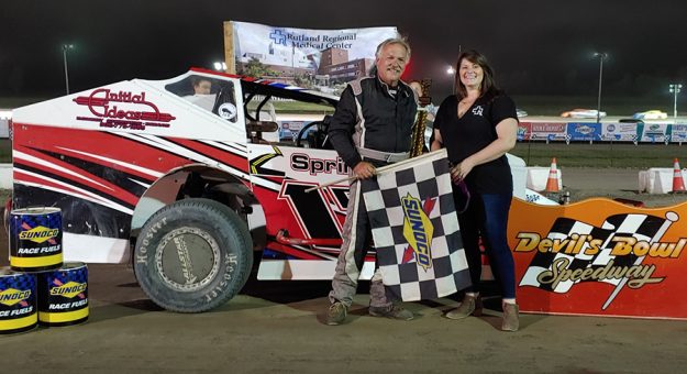 Elmo Reckner was all smiles after winning the Sportsman Modified feature on Sunday night at Devil's Bowl Speedway, shown here with Rutland Regional Medical Center's Naomi Chamberlain. (DBS Media Photo)
