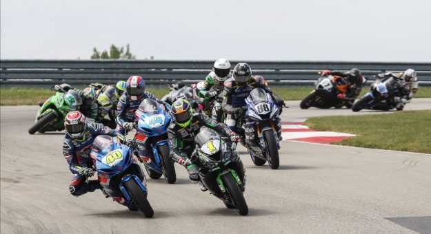 Sean Dylan Kelly (40) and Richie Escalante (1) fly in formation at the front of the Supersport pack on Sunday at PittRace. (Brian J. Nelson Photo)