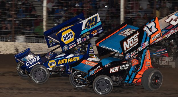 Brad Sweet (49) drove by Sheldon Haudenschild on the last lap to win Wednesday's World of Outlaws NOS Energy Drink Sprint Car Series feature at River Cities Speedway. (Trent Gower Photo)