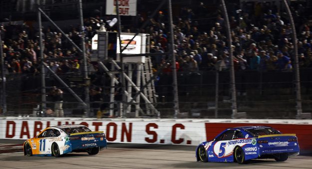 DARLINGTON, SOUTH CAROLINA - SEPTEMBER 05: Denny Hamlin, driver of the #11 Offerpad Toyota, leads Kyle Larson, driver of the #5 HendrickCars.com Chevrolet, to the finish line to win the NASCAR Cup Series Cook Out Southern 500 at Darlington Raceway on September 05, 2021 in Darlington, South Carolina. (Photo by Jared C. Tilton/Getty Images) | Getty Images