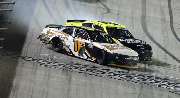 A.J. Allmendinger (16) and Austin Cindric (22) make contact as the cross the finish line Friday night at Bristol Motor Speedway. (HHP/Garry Eller Photo)