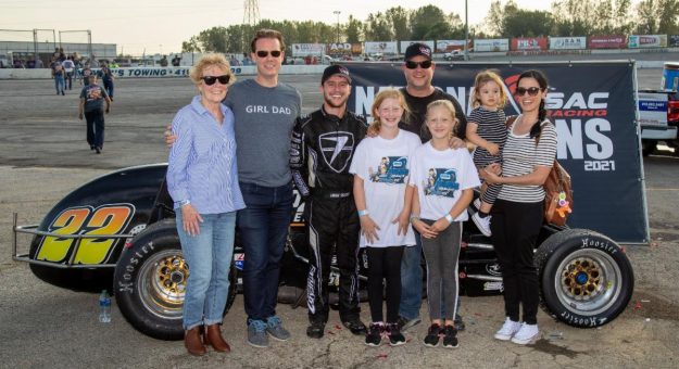 Robbie Rice (in black hat and shirt) celebrates with driver Logan Seavey and family after capturing the 2021 USAC Silver Crown Entrant Championship. (Rich Forman Photo)