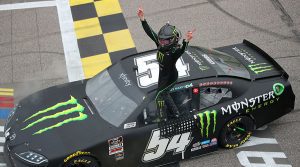 Ty Gibbs celebrates after winning Saturday's NASCAR Xfinity Series event at Kansas Speedway. (Meg Oliphant/Getty Images Photo)