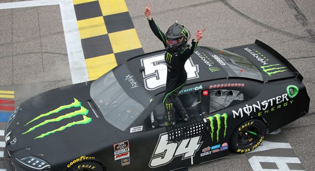 Ty Gibbs celebrates after winning Saturday's NASCAR Xfinity Series event at Kansas Speedway. (Meg Oliphant/Getty Images Photo)