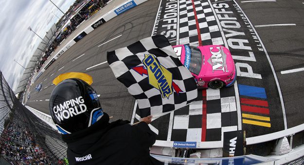 Zane Smith takes the checkered flag to win the NASCAR Camping World Truck Series race Martinsville Speedway on Saturday. (Brian Lawdermilk/Getty Images Photo)