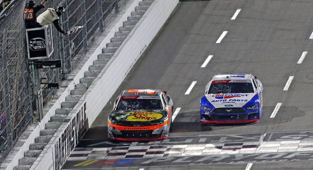 Noah Gragson (9) beats Austin Cindric (22) to the finish line to win Saturday's NASCAR Xfinity Series race at Martinsville Speedway. (HHP/Tim Parks Photo)