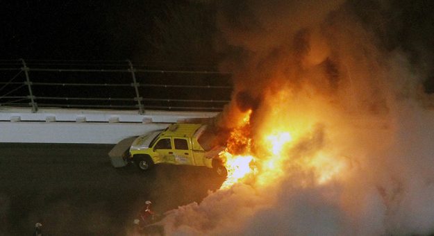 A jet dryer burns after it was hit under caution by Juan Pablo Montoya during the 2012 Daytona 500. (HHP/Brian Lawdermilk Photo)