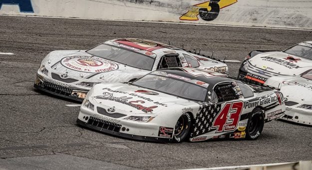 Derek Thorn (43) and Stephen Nasse (51) lead the Snowball Derby field to a restart last year at Five Flags Speedway. (Jason Reasin Photo)