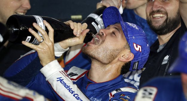 Kyle Larson celebrates after claiming the 2021 NASCAR Cup Series championship. (HHP/Andrew Coppley Photo)