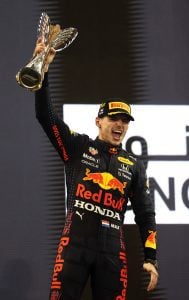 ABU DHABI, UNITED ARAB EMIRATES - DECEMBER 12: Race winner and 2021 F1 World Drivers Champion Max Verstappen of Netherlands and Red Bull Racing celebrates on the podium during the F1 Grand Prix of Abu Dhabi at Yas Marina Circuit on December 12, 2021 in Abu Dhabi, United Arab Emirates. (Photo by Lars Baron/Getty Images) // Getty Images / Red Bull Content Pool  // SI202112120304 // Usage for editorial use only // | Getty Images