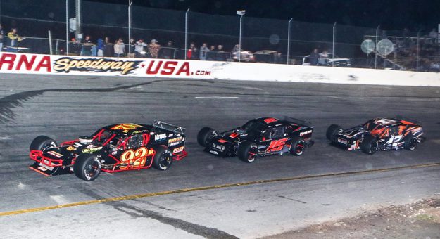 Anthony Nocella (92), Ron Silk (16) and Tommy Catalano race for position during the John Blewett III Memorial 76 Wednesday at New Smyrna Speedway. (Dick Ayers Photo)