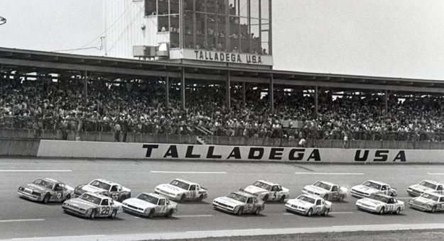 Cale Yarborough and Bill Elliott lead Benny Parsons, Terry Labonte, Dale Earnhardt, Geoffery Bodine, Ricky Rudd and the rest of the pack around the 175th lap of the Winston 500 in 1984. (NASCAR Photo)