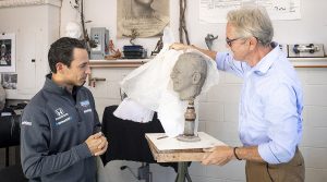 William Behrends (right) unveils Helio Castroneves' likeness that will eventually appear on the Borg-Warner Trophy. (Logan Whitton Photography Photo)