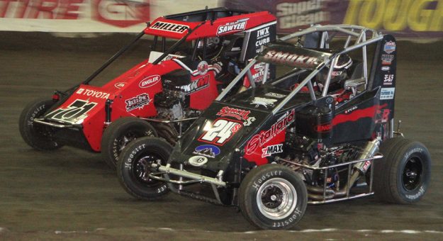 Gavin Miller (71) races around the outside of Colby Sokol during a stock non-winged heat race Thursday at the Tulsa Shootout. (Richard Bales Photo)