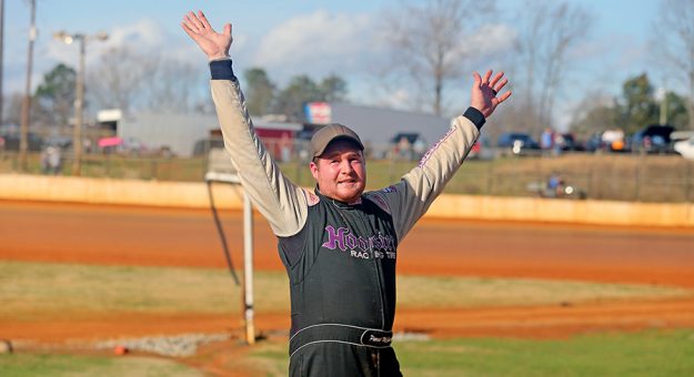 Pierce McCarter celebrates his victory in the Hangover Saturday at 411 Motor Speedway. (Chad Wells Photo)