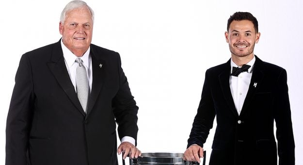 NASHVILLE, TENNESSEE - DECEMBER 02:  2021NASCAR Cup Series championship driver, Kyle Larson and NASCAR Hall of Famer and team owner Rick Hendrick(L) pose for photos with the Bill France NASCAR Cup Series Championship trophy during the  NASCAR Champion's Banquet at the Music City Center on December 02, 2021 in Nashville, Tennessee. (Photo by Chris Graythen/Getty Images) | Getty Images