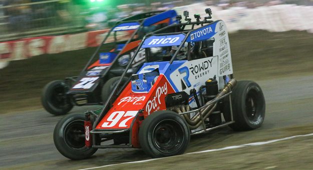 Rico Abreu (97) races under Colby Copeland Wednesday at the Lucas Oil Chili Bowl Nationals. (Brendon Bauman Photo)