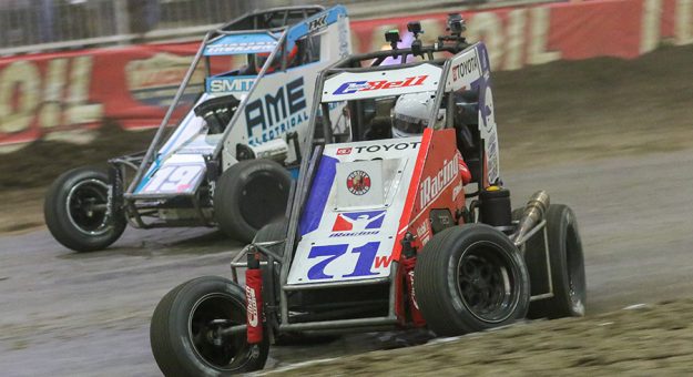 Christopher Bell (71) races under Tanner Thorson in a battle for the race lead Thursday inside the Tulsa Expo Center. (Brendon Bauman Photo)