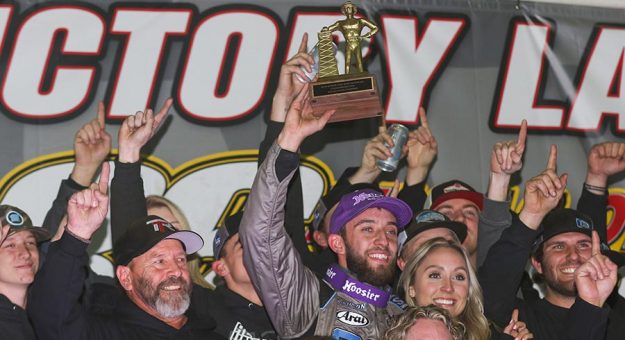 Tanner Thorson celebrates with his team after winning the 36th Lucas Oil Chili Bowl Nationals. (Brendon Bauman Photo)