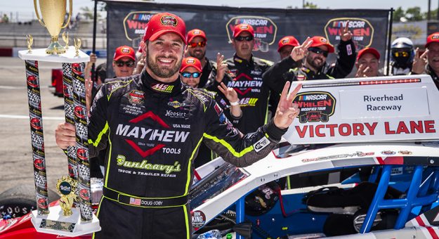 Doug Coby, driver of the #10 Mayhew Tools Ford, celebrates in Victory Lane after winning the Buzz Chew Chevrolet Cadillac 200 for the Whelen Modified Tour at Riverhead Raceway on June 20, 2021 in Riverhead, New York. (Adam Glanzman/NASCAR)