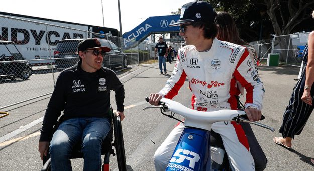 Robert Wickens (left) talks with Colton Herta in 2019. (IndyCar Photo)