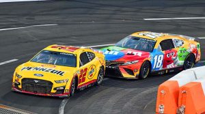 Joey Logano (22) leads Kyle Busch during the Busch Light Clash at the Coliseum. (Steve Himelstein Photo)