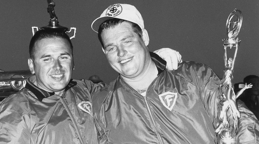 DAYTONA BEACH, FL - FEBRUARY 24, 1963:  Tiny Lund (right) was a last-minute substitute for the Wood Brothers team after their regular driver Marvin Panch was injured in an earlier crash.  In storybook fashion, Lund took the race and became a much-loved figure in early NASCAR racing.  (Photo by RacingOne/Getty Images)