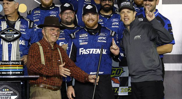 Chris Buescher (center) is joined in victory lane by Jack Roush (left) and Brad Keselowski after the second Duel race Thursday at Daytona International Speedway. (Chris Graythen/Getty Images Photo)