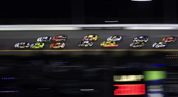 DAYTONA BEACH, FLORIDA - FEBRUARY 20: Austin Cindric, driver of the #2 Discount Tire Ford, leads the field during the NASCAR Cup Series 64th Annual Daytona 500 at Daytona International Speedway on February 20, 2022 in Daytona Beach, Florida. (Photo by Mike Ehrmann/Getty Images) | Getty Images