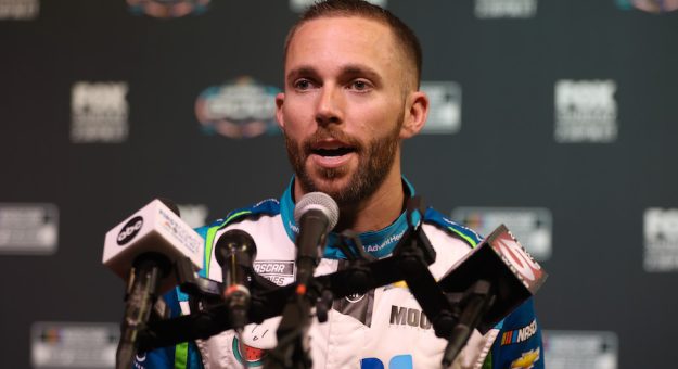DAYTONA BEACH, FLORIDA - FEBRUARY 16: Ross Chastain, driver of the #1 Advent Health Chevrolet, speaks to the media during the NASCAR Cup Series 64th Annual Daytona 500 Media Day at Daytona International Speedway on February 16, 2022 in Daytona Beach, Florida. (Photo by James Gilbert/Getty Images)