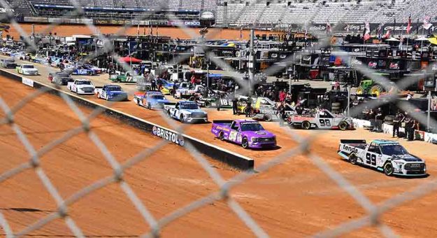 BRISTOL, TENNESSEE - APRIL 15: A general view ofduring of the grid during first practice for the NASCAR Camping World Truck Series Pinty's Truck Race on Dirt at Bristol Motor Speedway on April 15, 2022 in Bristol, Tennessee. (Photo by Logan Riely/Getty Images) | Getty Images